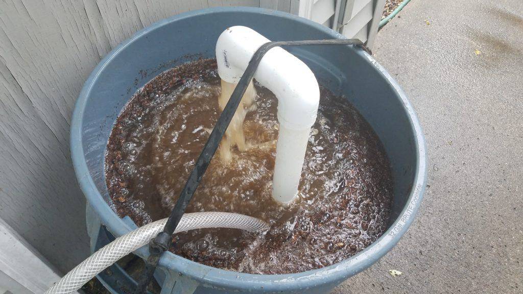 An aerating bin of compost tea.