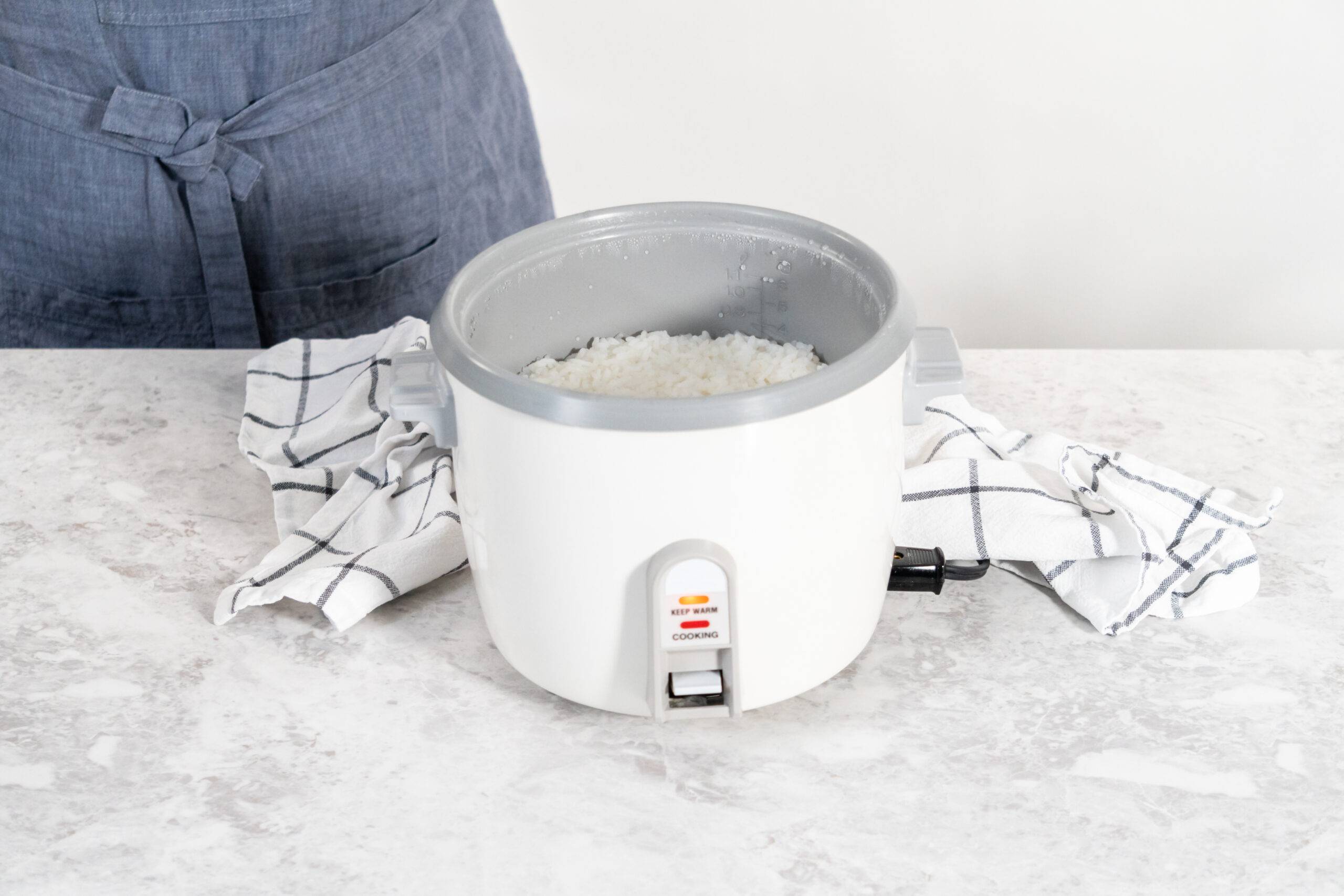 Freshly cooked white rice in a rice cooker.