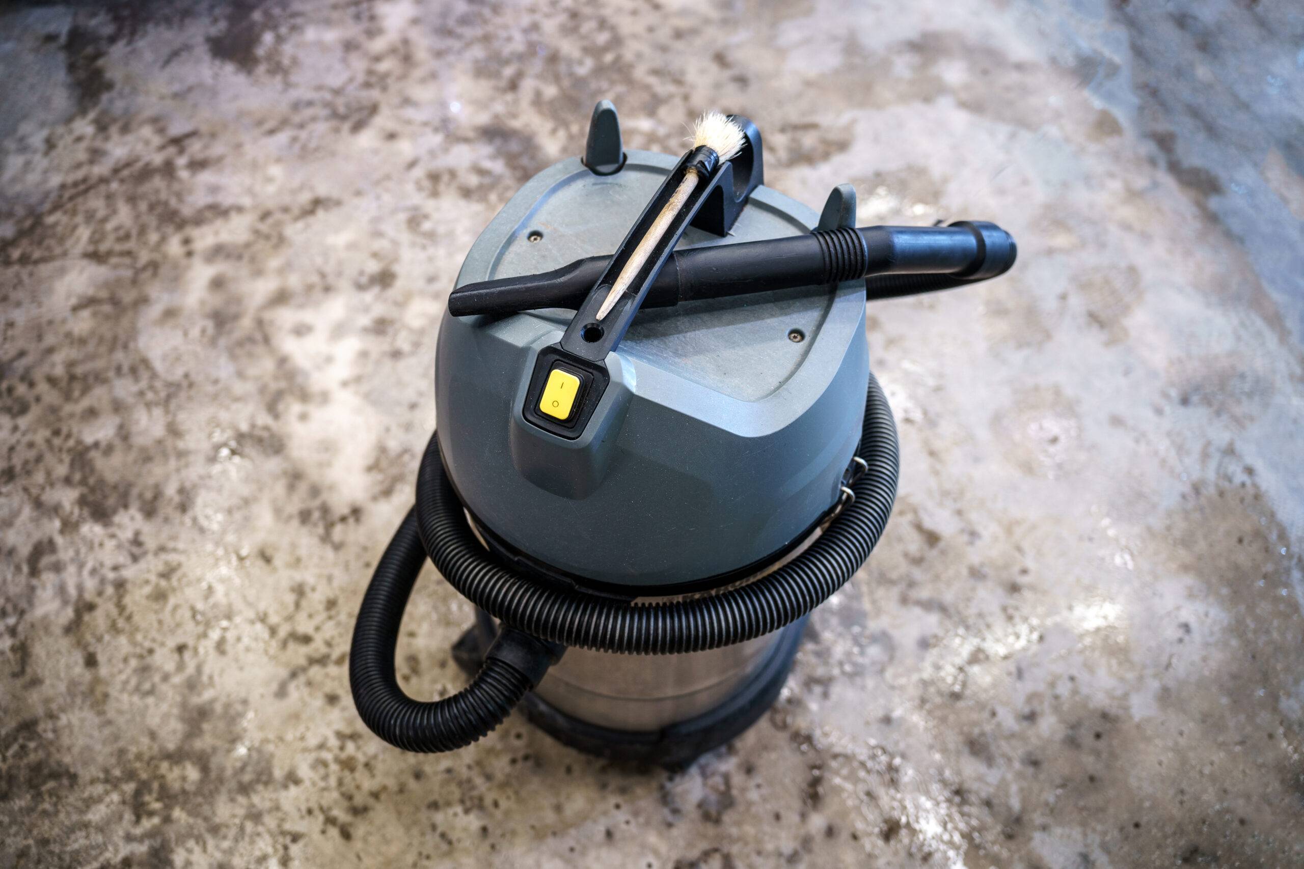Car detailing studio. Industrial vacuum cleaner for car interior cleaning