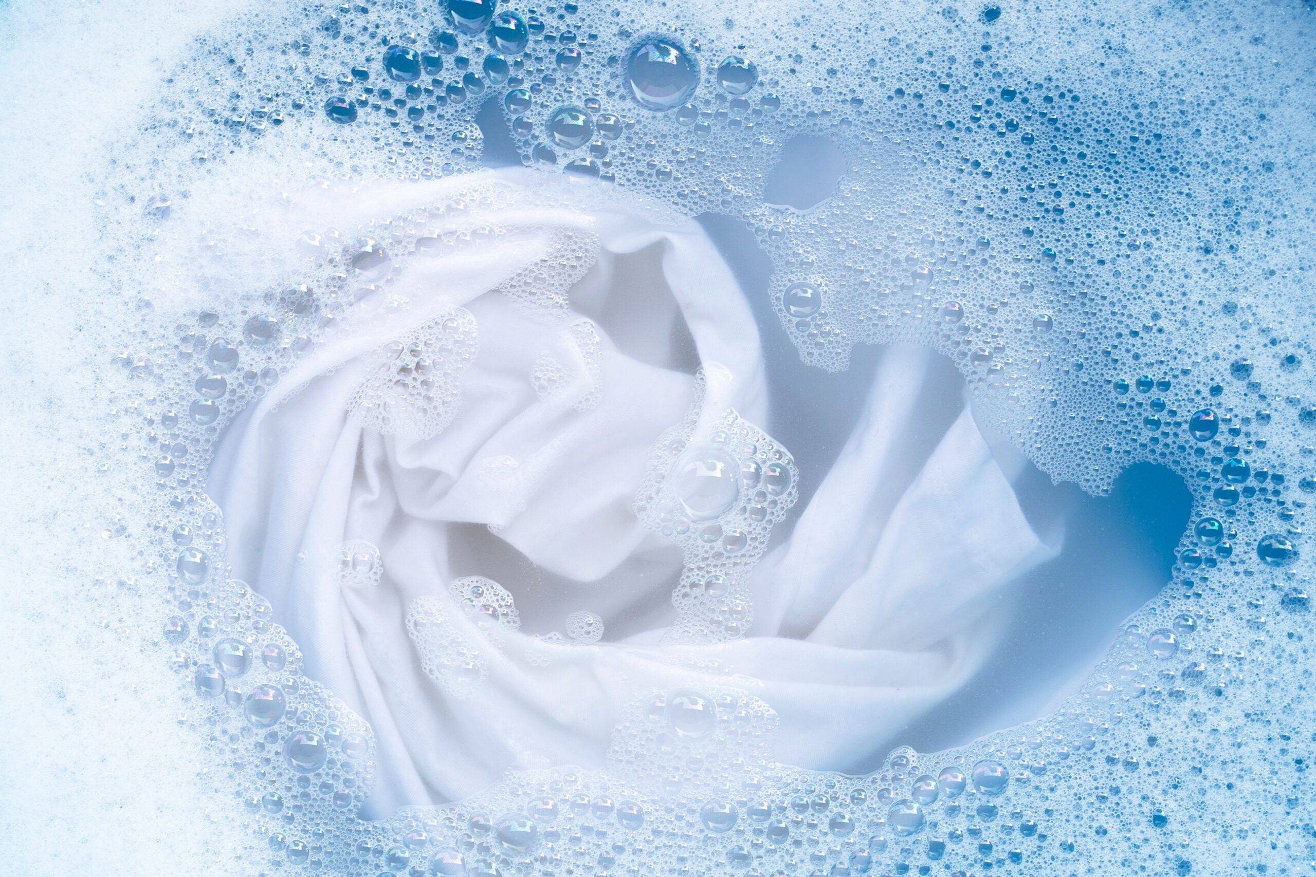 Top view of soak a cloth before washing, white cloth