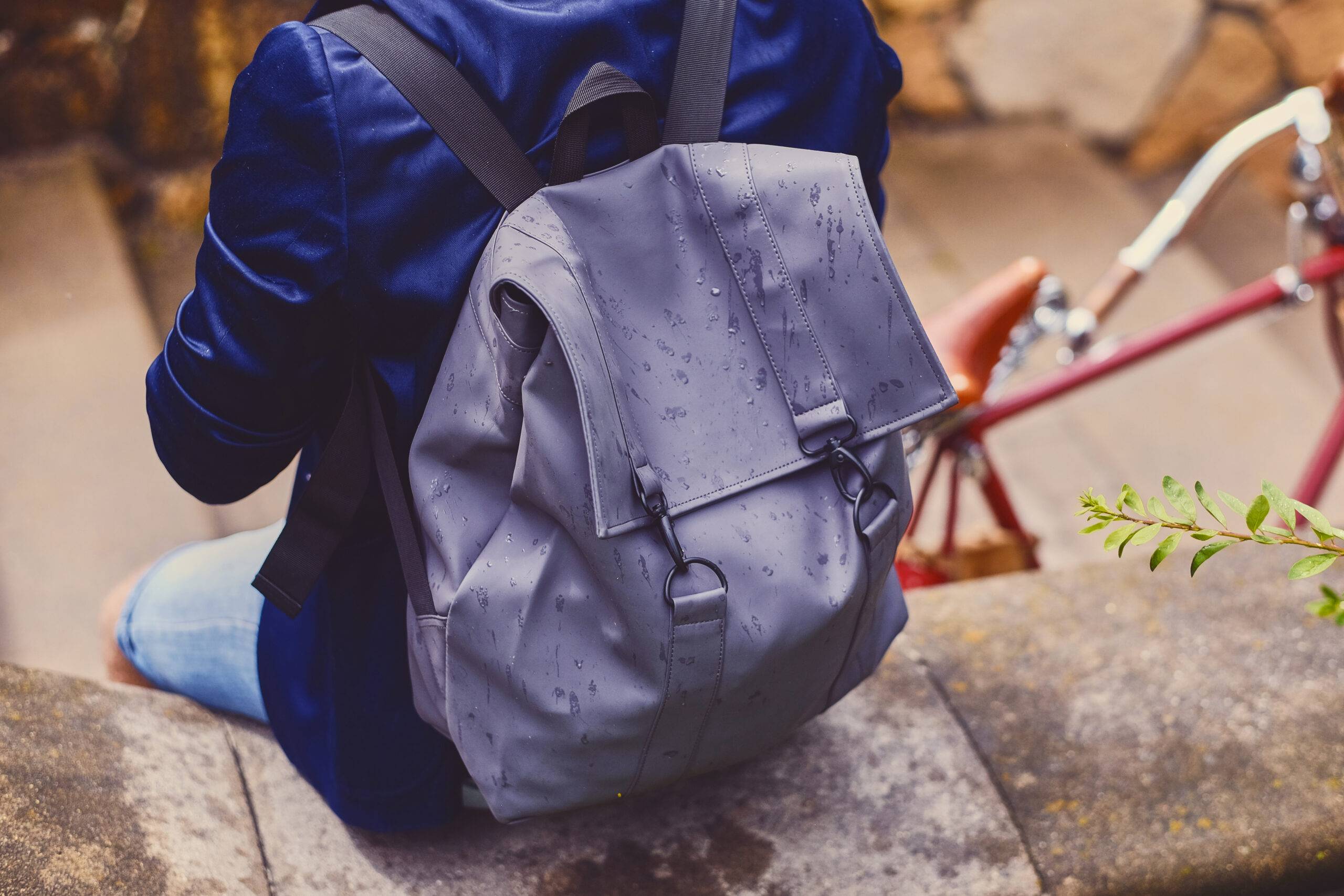 Back view of the traveler male with a backpack.