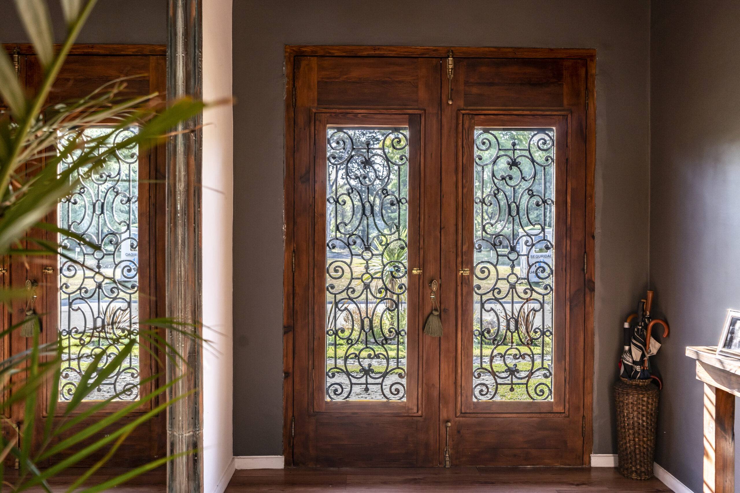 View of a trendy wooden front door from the inside