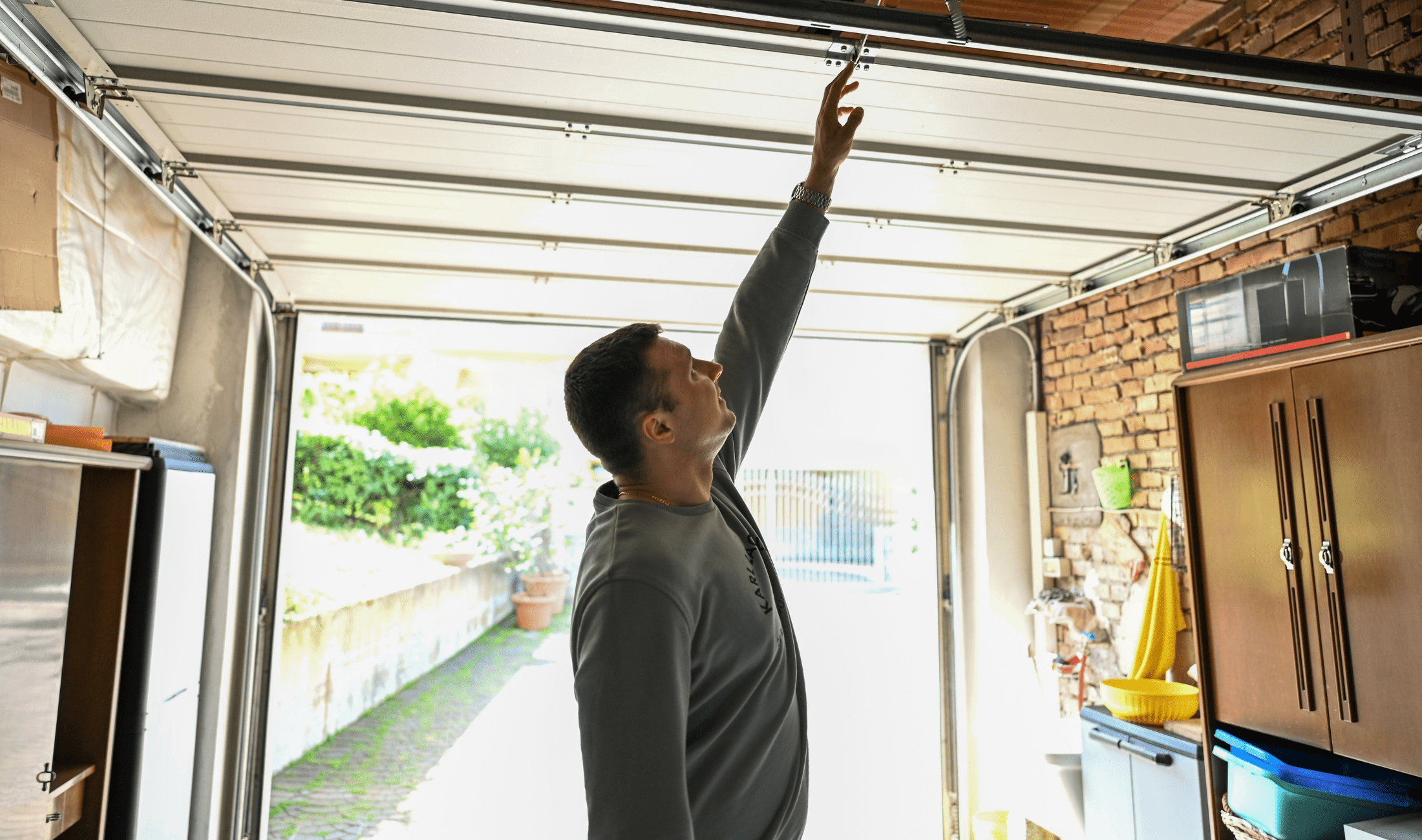 A man opening his garage door.
