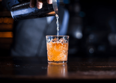 old fashioned cocktail being made
